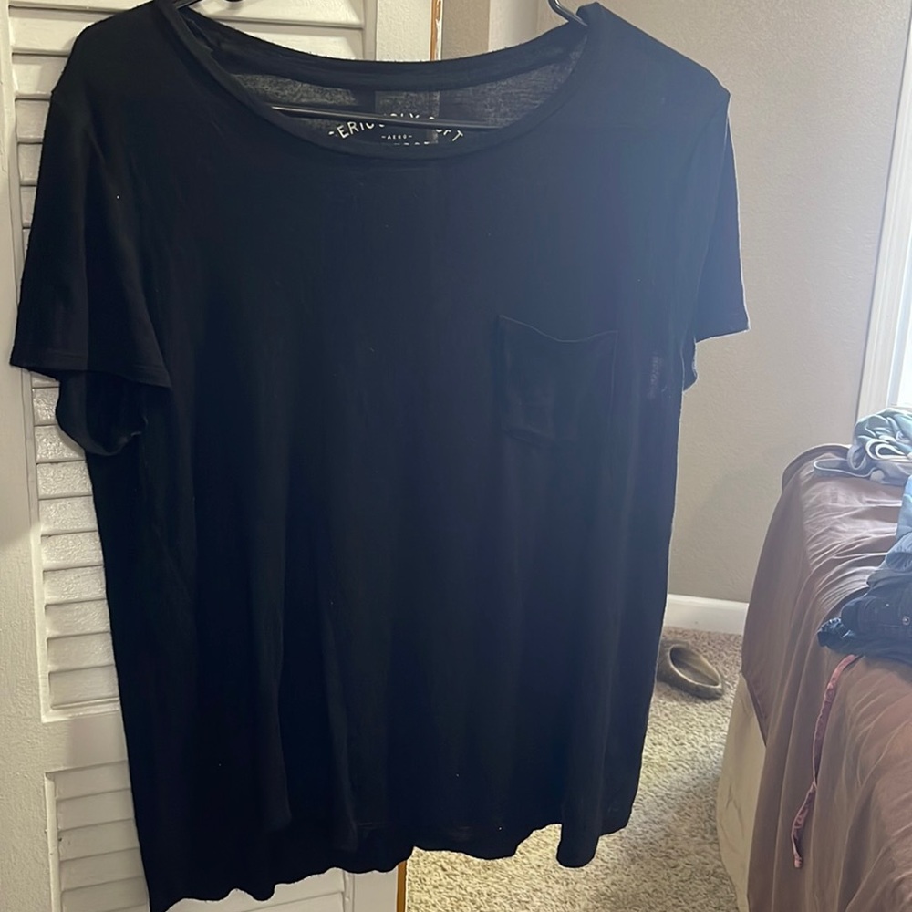 Black tshirt with left pocket. Seriously Soft in size Large. Very comfortable.